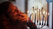 lev-yarden-lighting-cigarette-with-lit-hanukia_24_0543.jpg